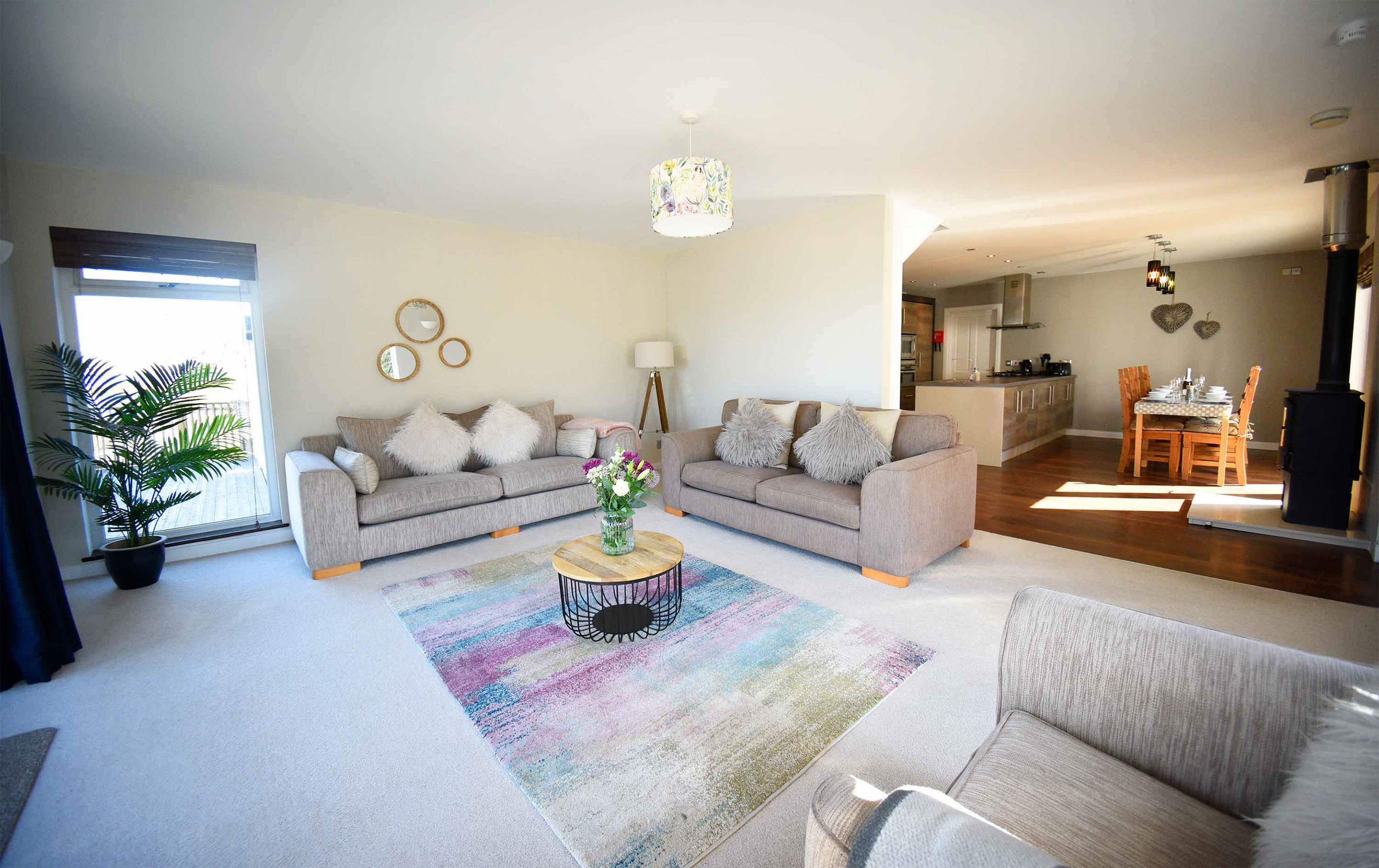 The Boathouse is an open plan luxury self catering apartment with comfortable seating and a modern kitchen